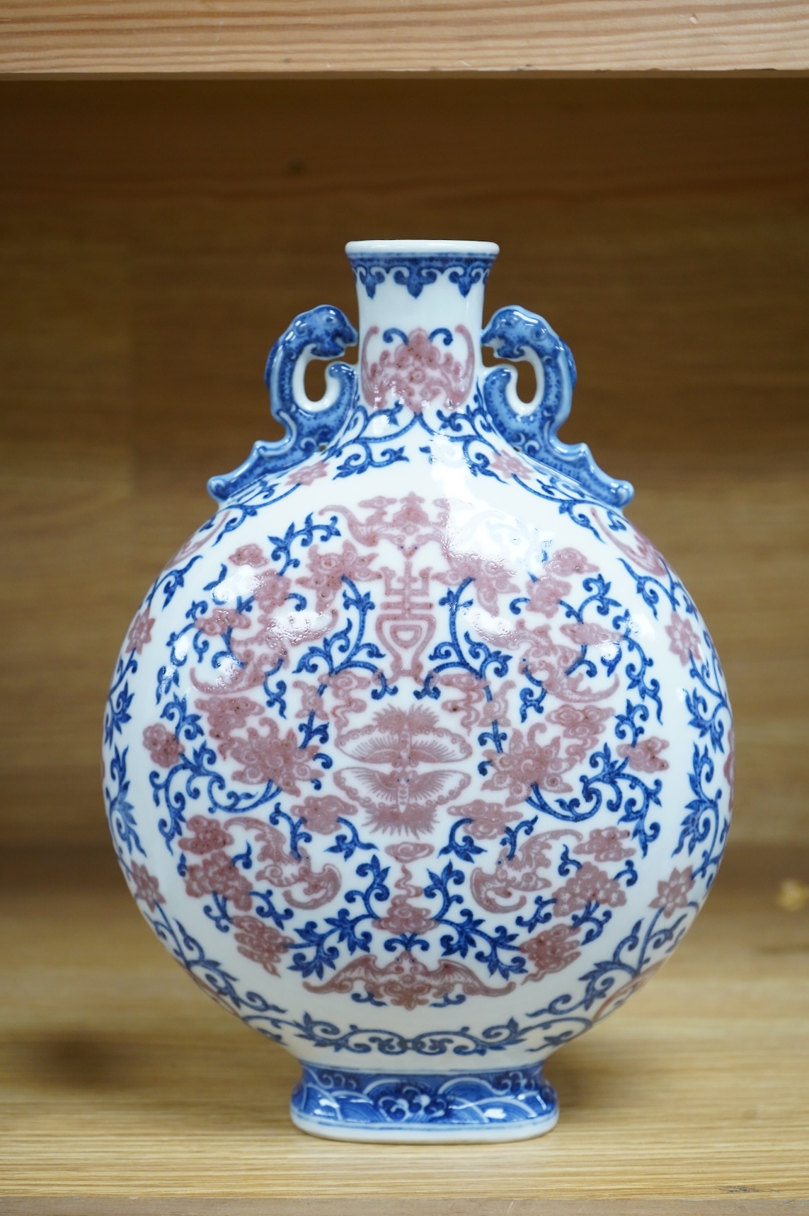 A 20th century Chinese underglaze blue and copper red moonflask, seal mark to base, 26.5cm